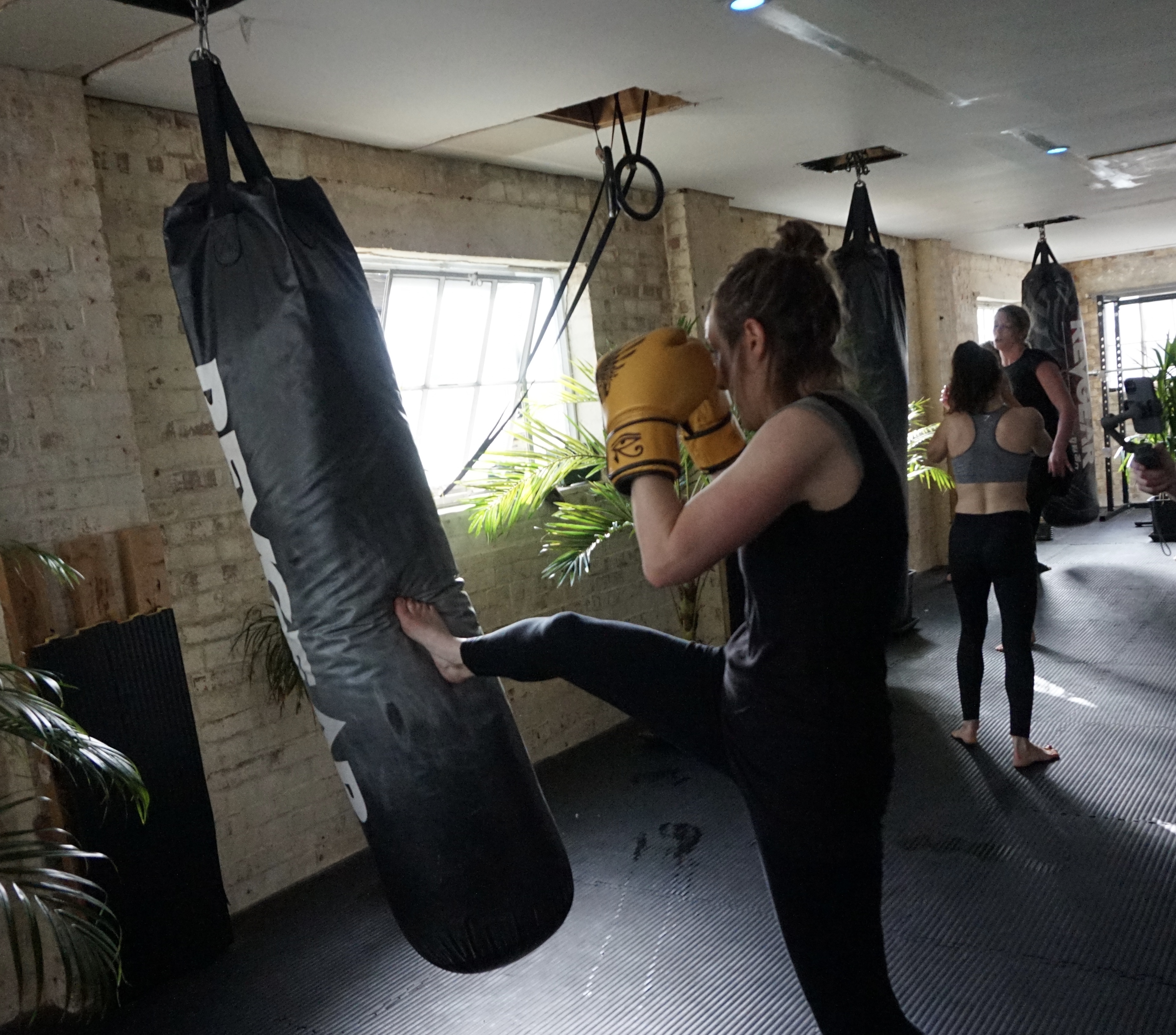 Women's kickboxing training at Xin Dojo